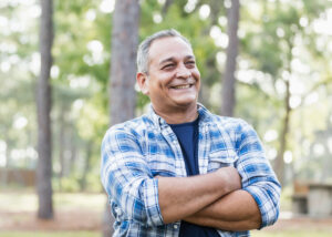 Man smiling while enjoying the outdoors