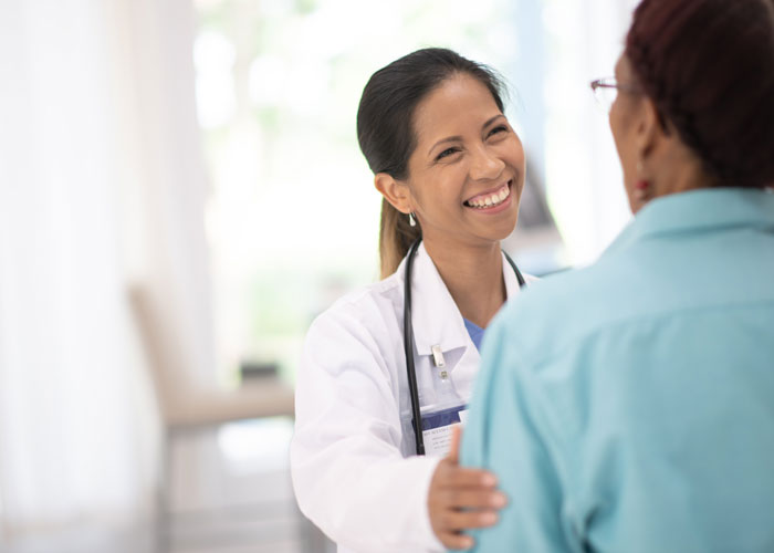 Patient and Doctor having a friendly conversation
