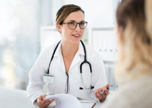 Dentist discussing dental treatment with patient in Atlanta, GA 