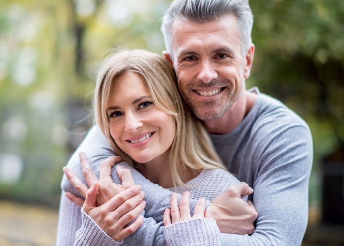 Couple smiling and posing for the camera
