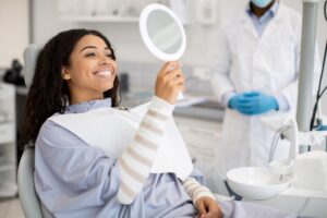 The girl smiling after teeth cleaning in dental clinic at Atlanta, GA