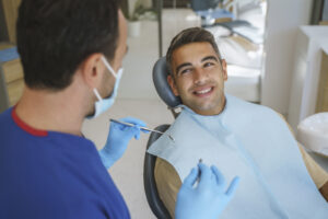 The Doctor explaining benefits of Dental implants for patient at Atlanta, GA