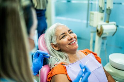 Woman having teeth examined by a dentist in Atlanta, GA