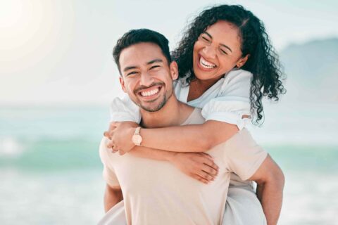 A happy couple enjoying their time on the beach in Atlanta, GA
