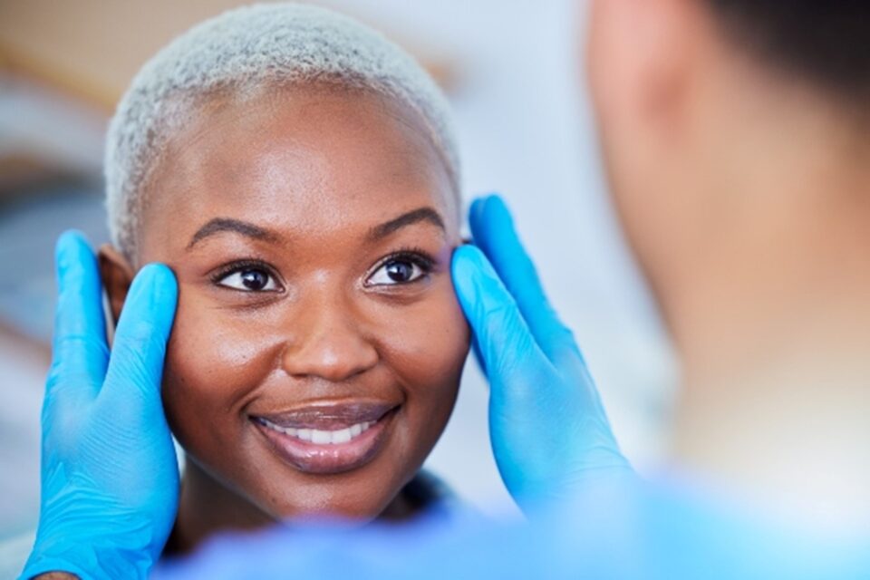 Woman receiving facial reconstructive surgery consultation