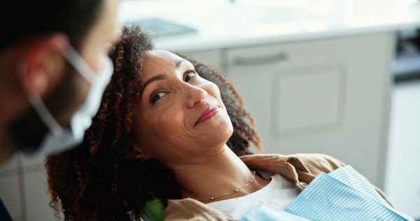 Woman with oral surgeon during consultation
