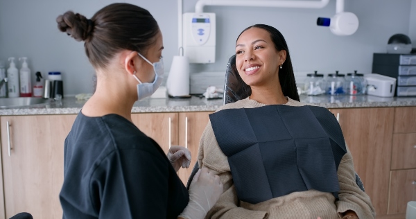 Oral surgeon explaining ambulatory anesthesia to patient