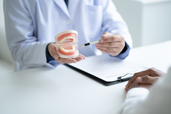 Oral surgeon explaining guided tissue regeneration